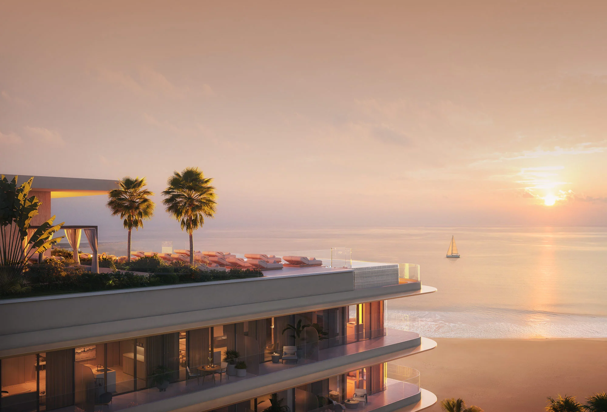 Luxury beachfront terrace at sunset with infinity pool and sea views